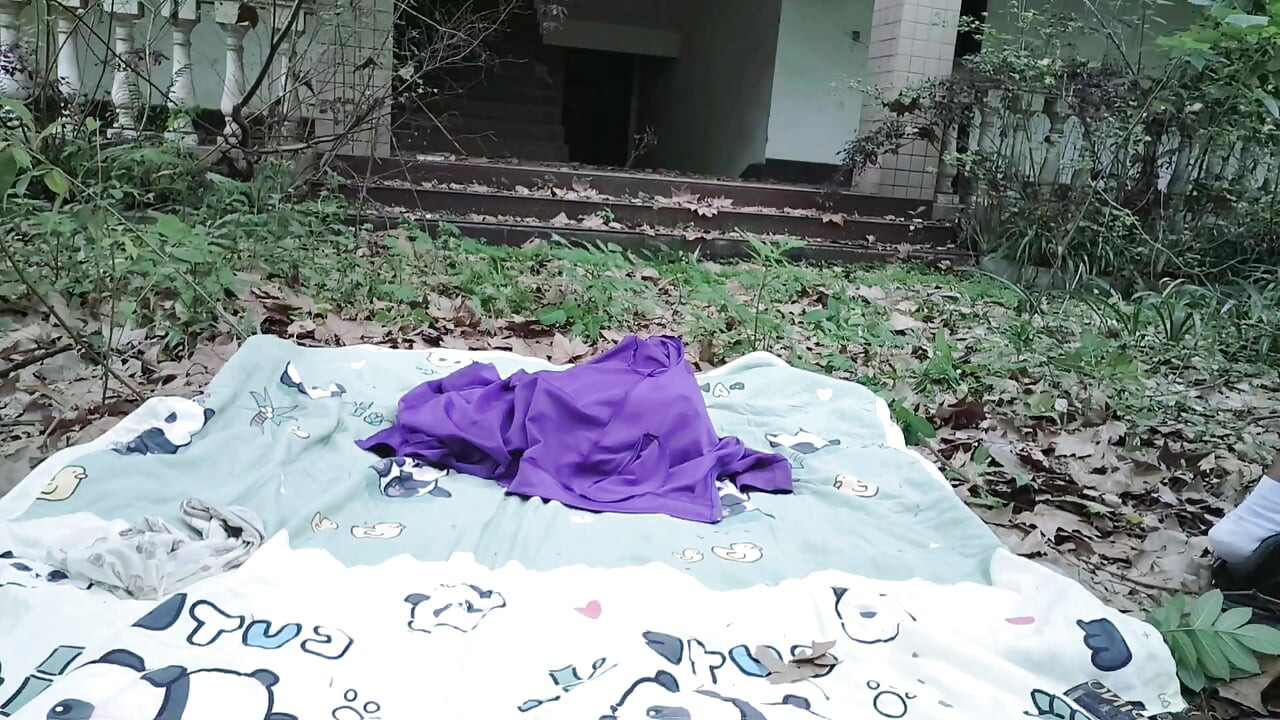A mischievous Asian boy masturbates, moaning and ejaculating in the atrium garden of an abandoned hotel