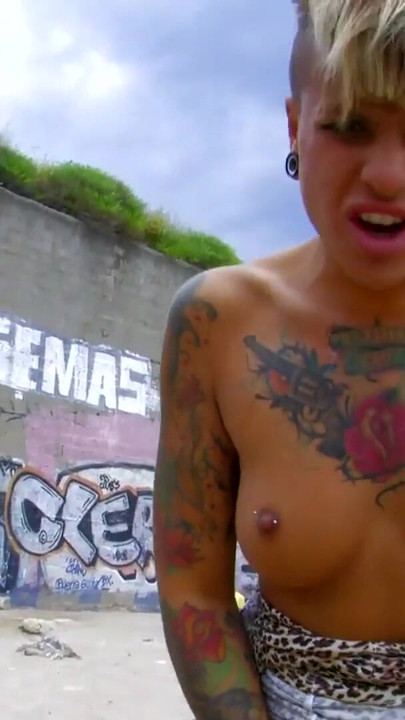 Powerful moment from "Horny tattoed blond teen with pierced nipples takes deepthroat on beach"