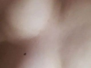 Dancing tits while lying in bed