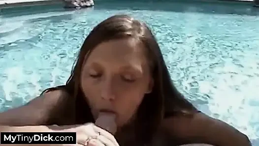 A Horny Brunette by the Pool Is Sucking off His Small Cock