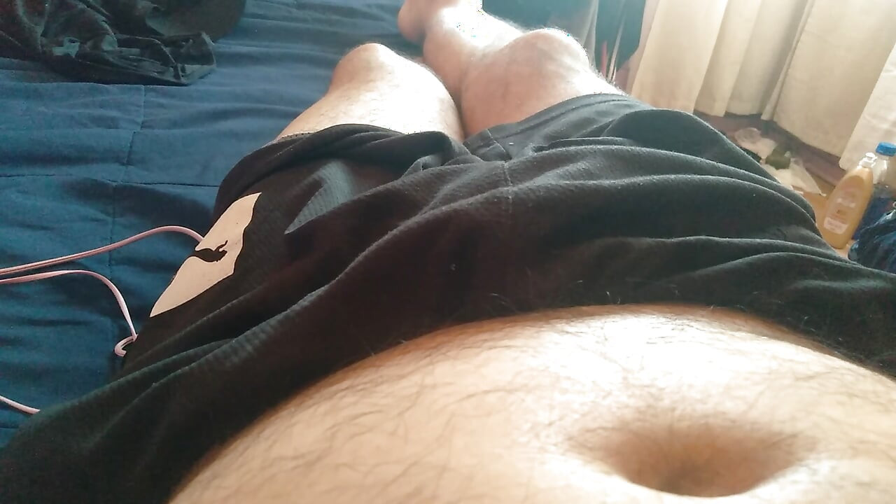 A muscular man with a big penis dreams of deep throating in the bedroom.