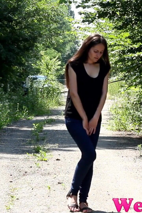 Wide open legs peeing outdoor and Desperate to pee, she has to pee in front of the car in her jeans