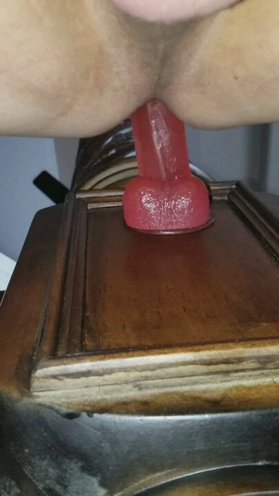 Crossdresser riding thick pink dildo