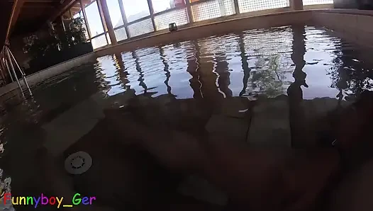 A chubby gay guy plays underwater with his semi-hard cock while naked in a thermal pool, having to be careful not to get caught.