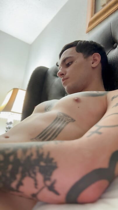 Adult starts to insert piercing into hole and pre