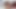 Lascivious black girl using her vibrator to pleasure a sexy girl on the bed