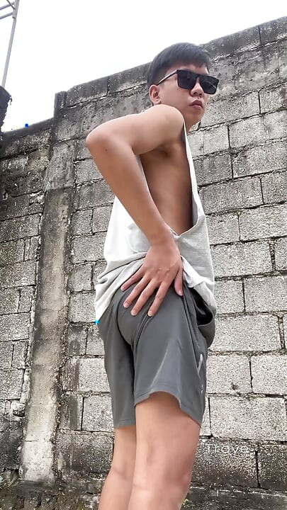 Cute Asian takes a morning walk at the park and masturbates