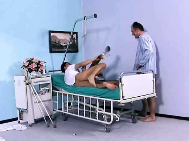 Nurse Checks Patient's Vitals