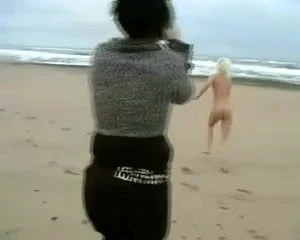 Daring Blond Bares All on a Cold Beach