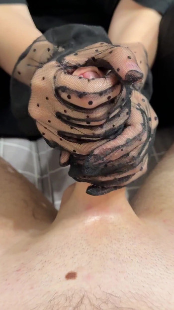 Mistress in Gloves Dominates Guy with Footjob in Nylon Socks