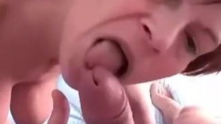 MILF with big tits gives a serious BJ, gets a nice facial.