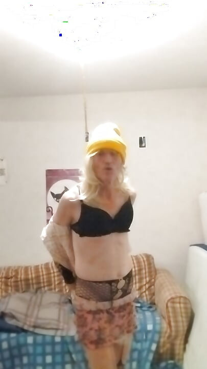 The blonde in the yellow cap shows off all excited...!! ...