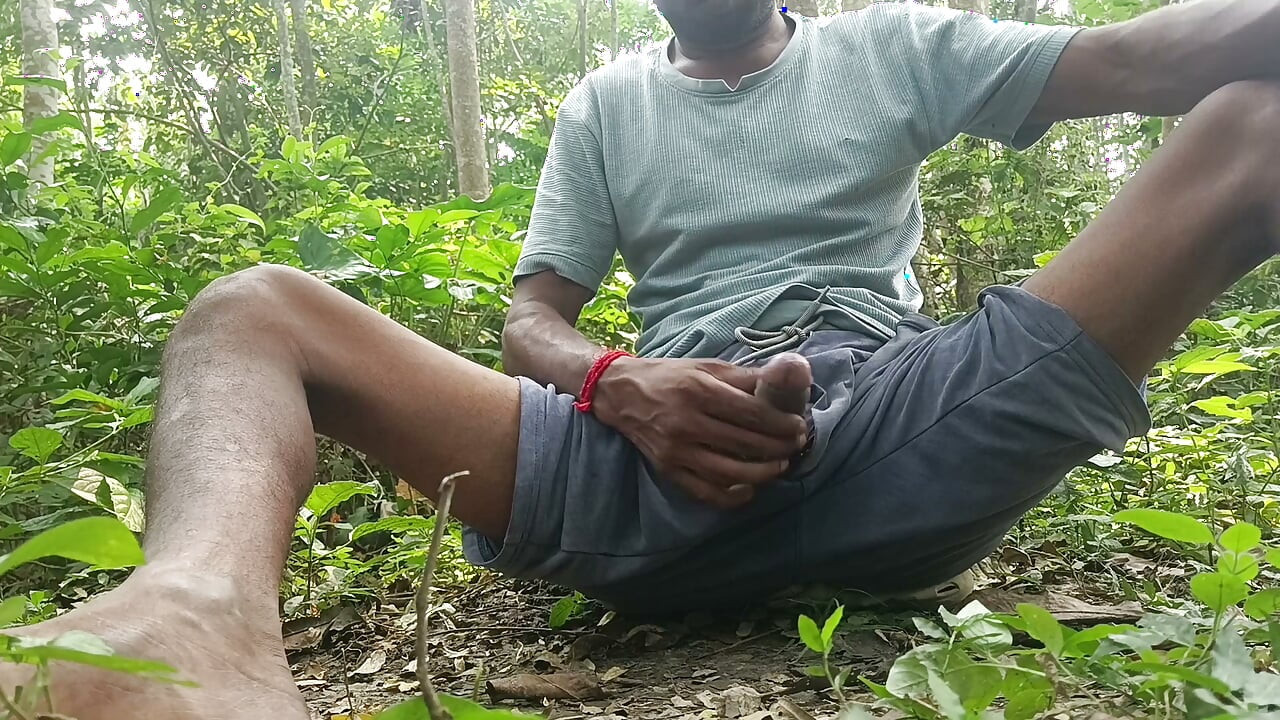 Indian mature masterbating in forest.