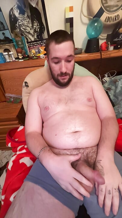 Chubby boy jerks off in bed