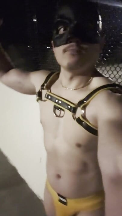 Midnight Muscle Tease: Asian Hunk Flexes Ass & Biceps in Yellow Harness on Highway Bridge