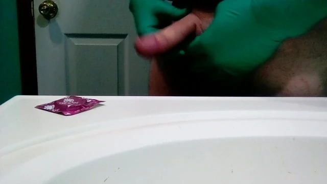 Green surgical gloves and condom