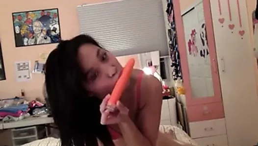 sexy asian teases with her orange dildo (non-nude)