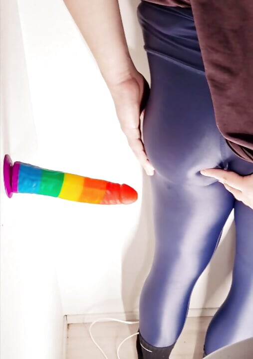 Crossdresser enjoying big toy in shiny leggings