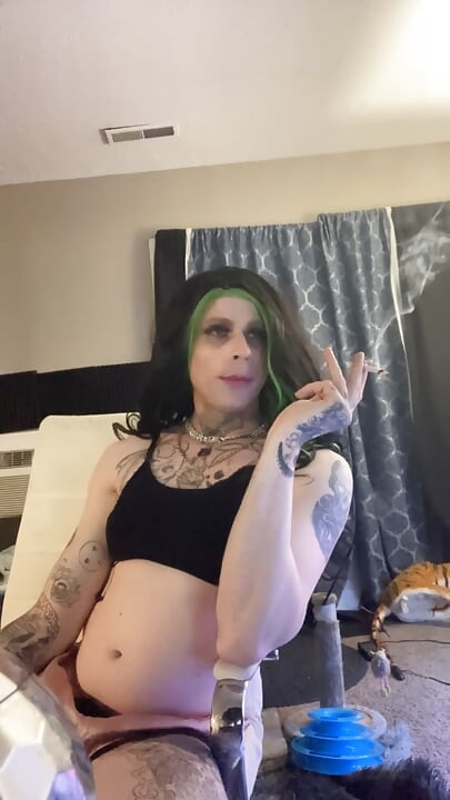 Sexy crossdresser smokes