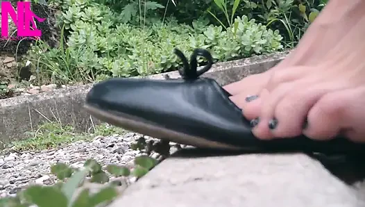 Shoeplay with Black Leather Flats on Barefoot Outside