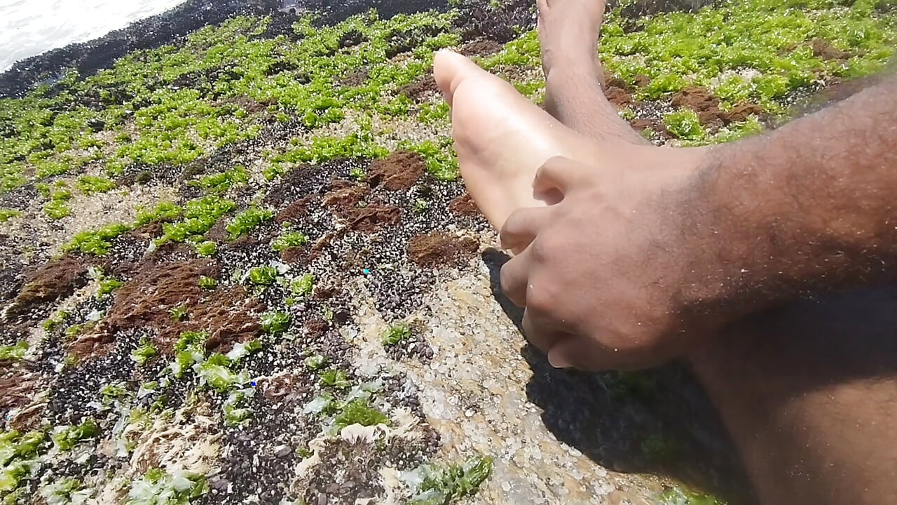 massaging my feet on the beach