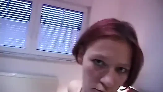 Redhead teen rubs and fingers her wet twat