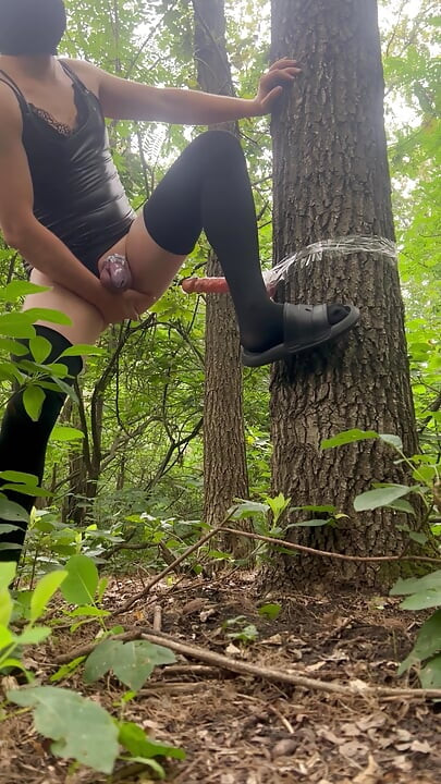 Sissy bitch had an extreme dildo fuck in the park and experienced a pygasm in a chastity belt