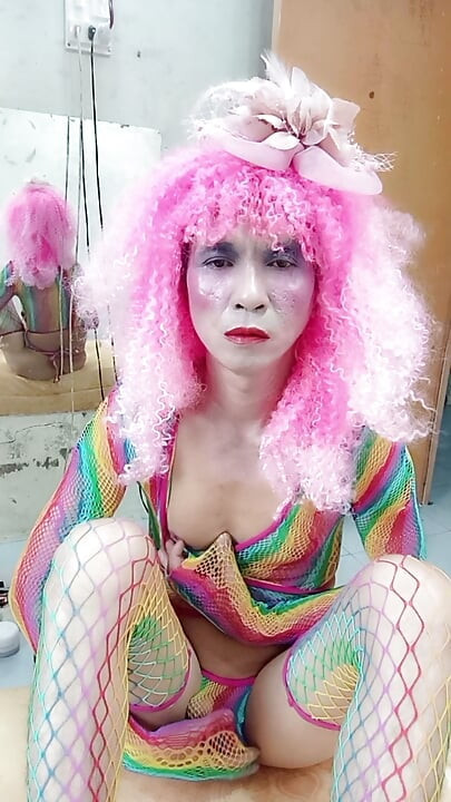 Transgender Le wears sexy clothes and plays cups of sex. Artificial cans