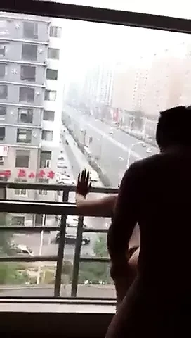 Filming his wife gets fucked at open window