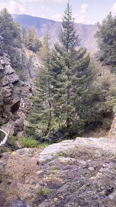 Hiking By A Waterfall