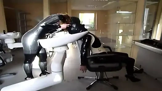 Masked redhead in latex gets tied up