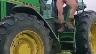 field man on tractor working naked