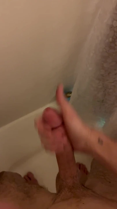 Young slim twink strokes big cock, squirts in the shower.