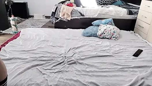 Sexy brunette doing naked chores around the house.