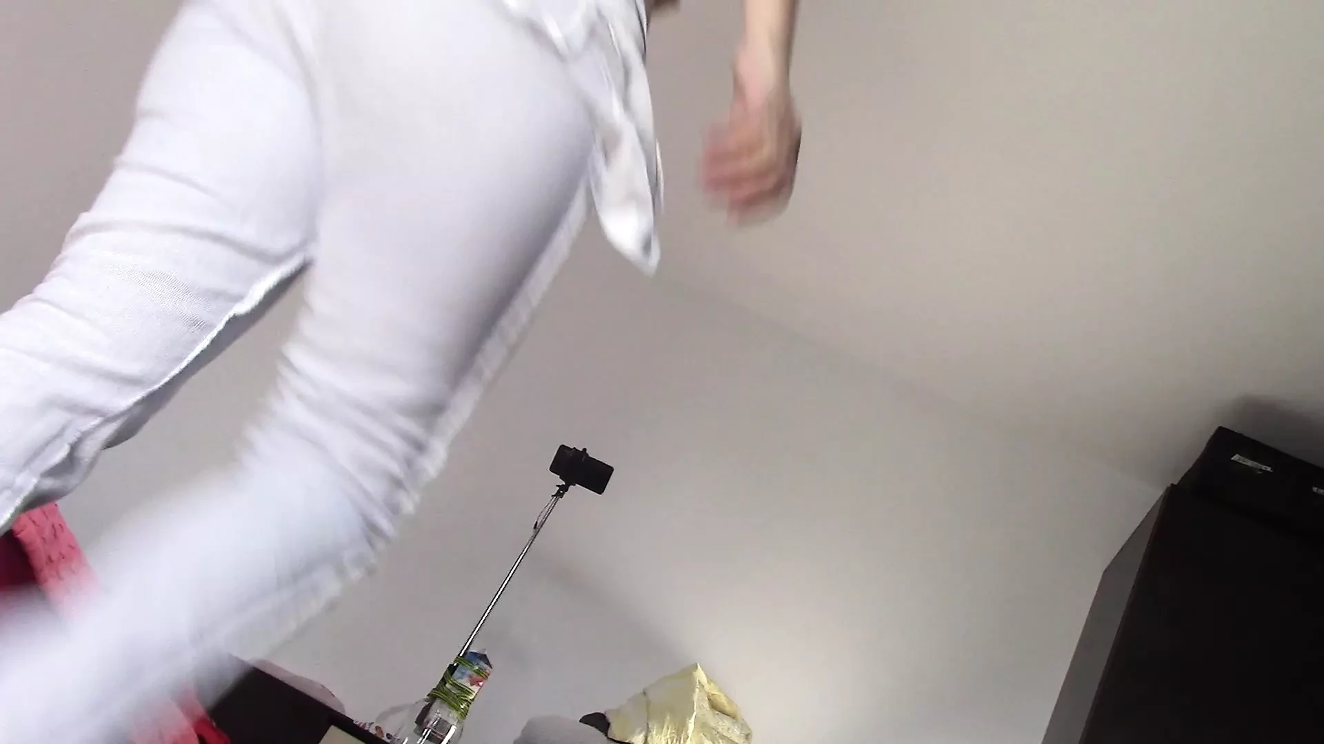 Amateur wife dancing naked at home. Amateur woman has fun trying on clothes and cutting them.