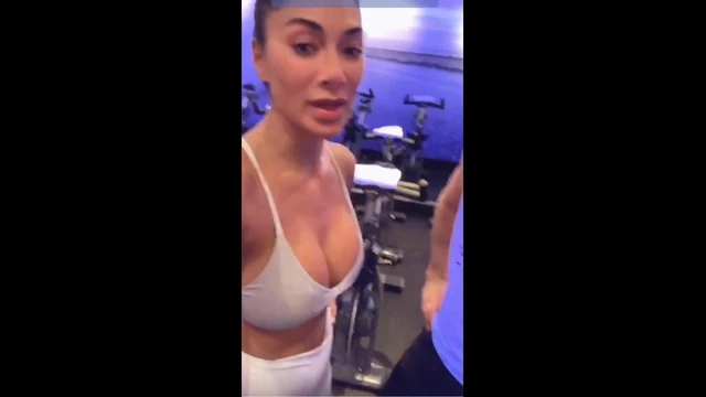 Nicole Scherzinger in gym showing big cleavage in white top