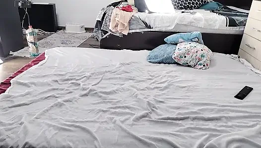 Sexy brunette doing naked chores around the house.