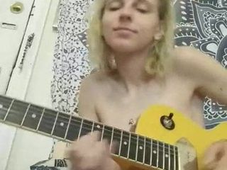 Happy naked babe jamming