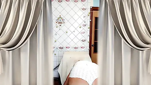 Hot housewife Lukerya. A mature Ukrainian woman shows off her figure and poses for the camera at home.