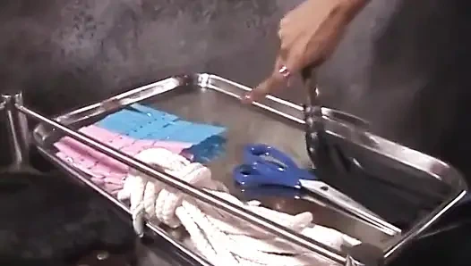 Hot black whore gets her mouth taped and is bound to chair