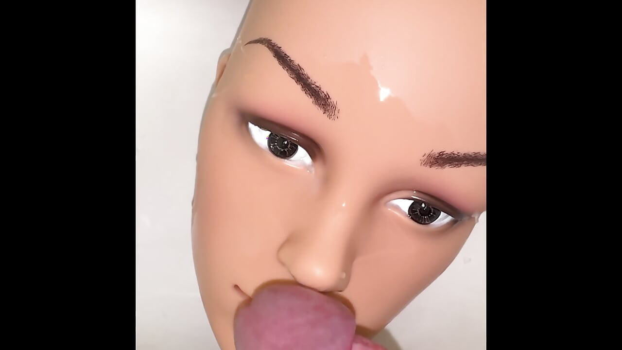 Pissing on a mannequin doll's face