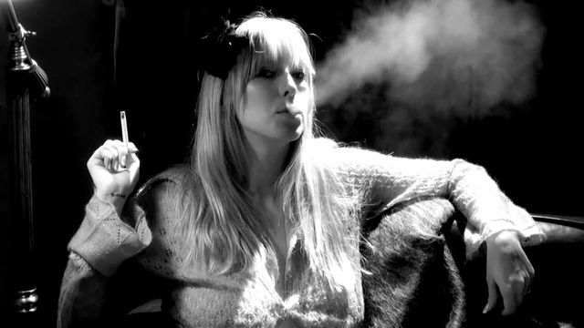 Blonde smokes seductlively