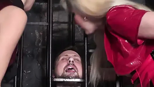 Two ladies dominate their slave