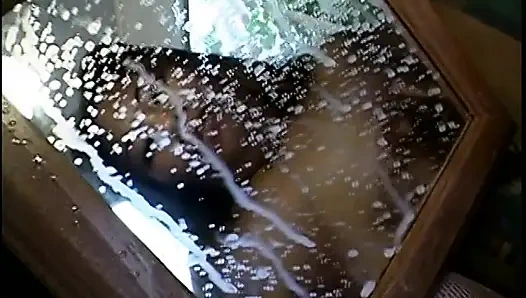 Asian girl is milking her tits in the mirror for you