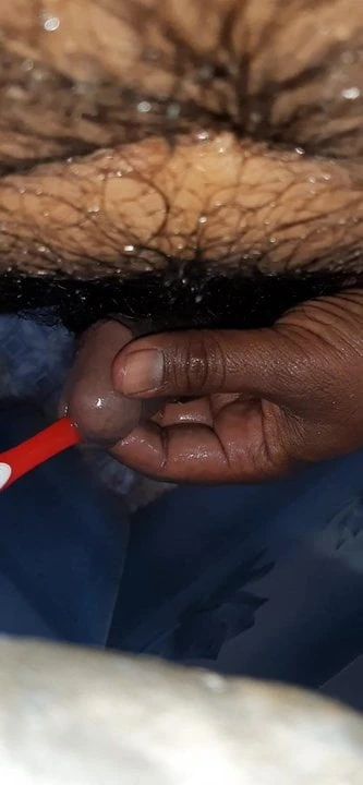 Desi inserting tooth brush in cock