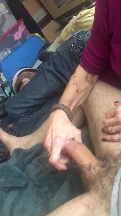 Skinny granny Sue stroking on a cock
