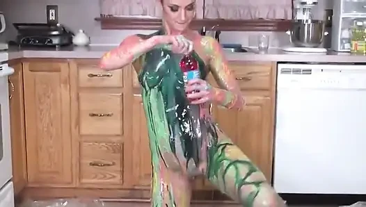 Hot girl puts colors  all on her tits and her pussy in the kitchen