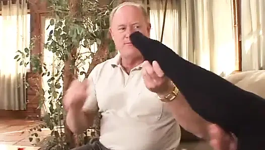 Small tits blonde helps older man to jerk off with her feet