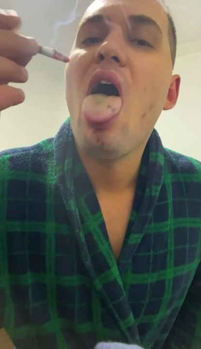 Cigarette extinguished on tongue. extreme smoking, masochistic fetish, pain smoking, tongue torture.