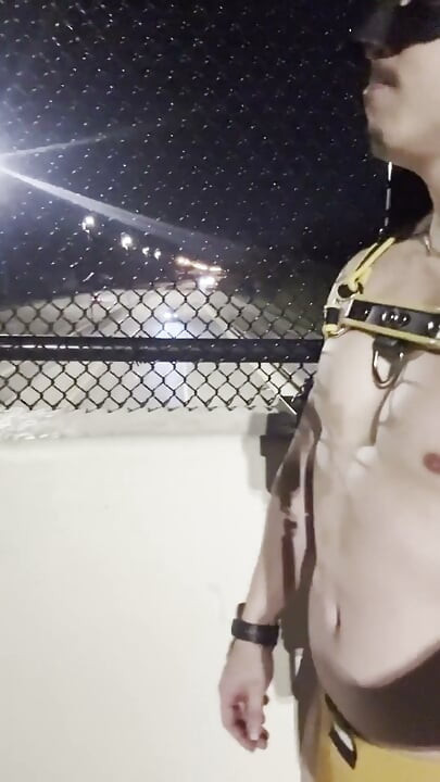 Midnight Muscle Tease: Asian Hunk Flexes Ass & Biceps in Yellow Harness on Highway Bridge